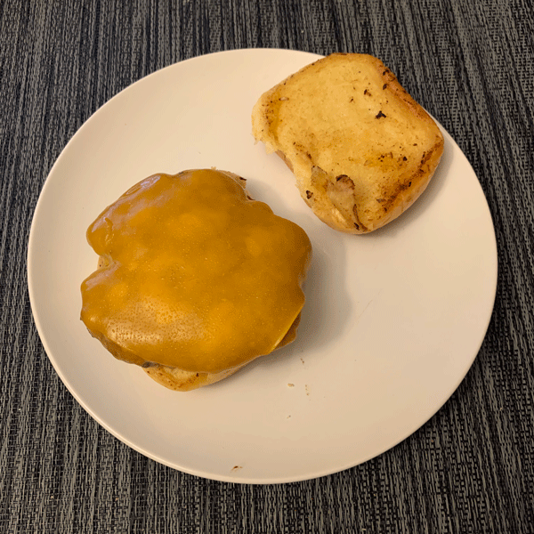 Mushroom Patty Burger on a Toasted Bun with Melted Cheddar Cheese