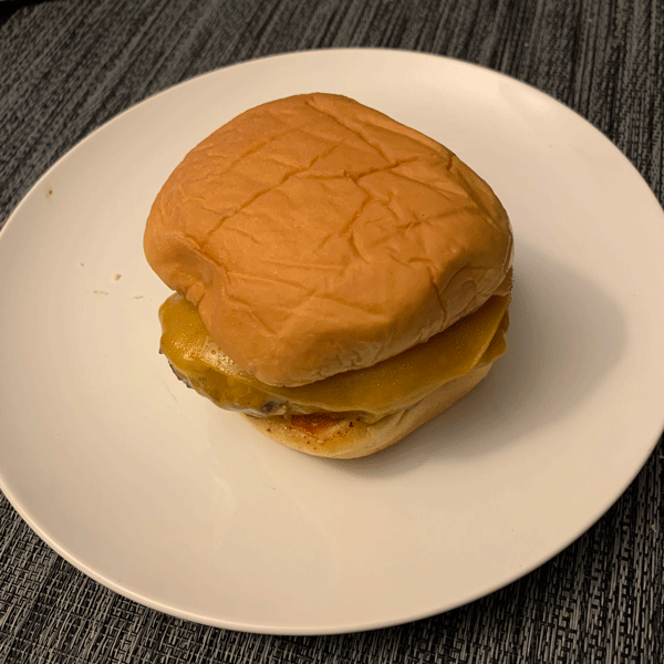 Mushroom Patty Burger on a Toasted Bun with Melted Cheddar Cheese