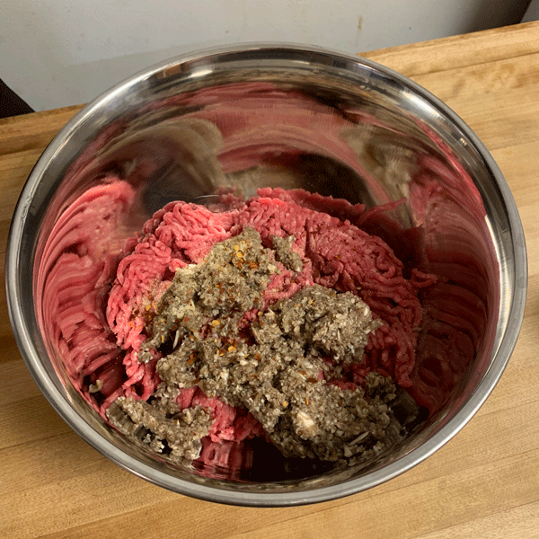 Mushrooms and Other Seasonings On Top of the Ground Beef Before Mixing